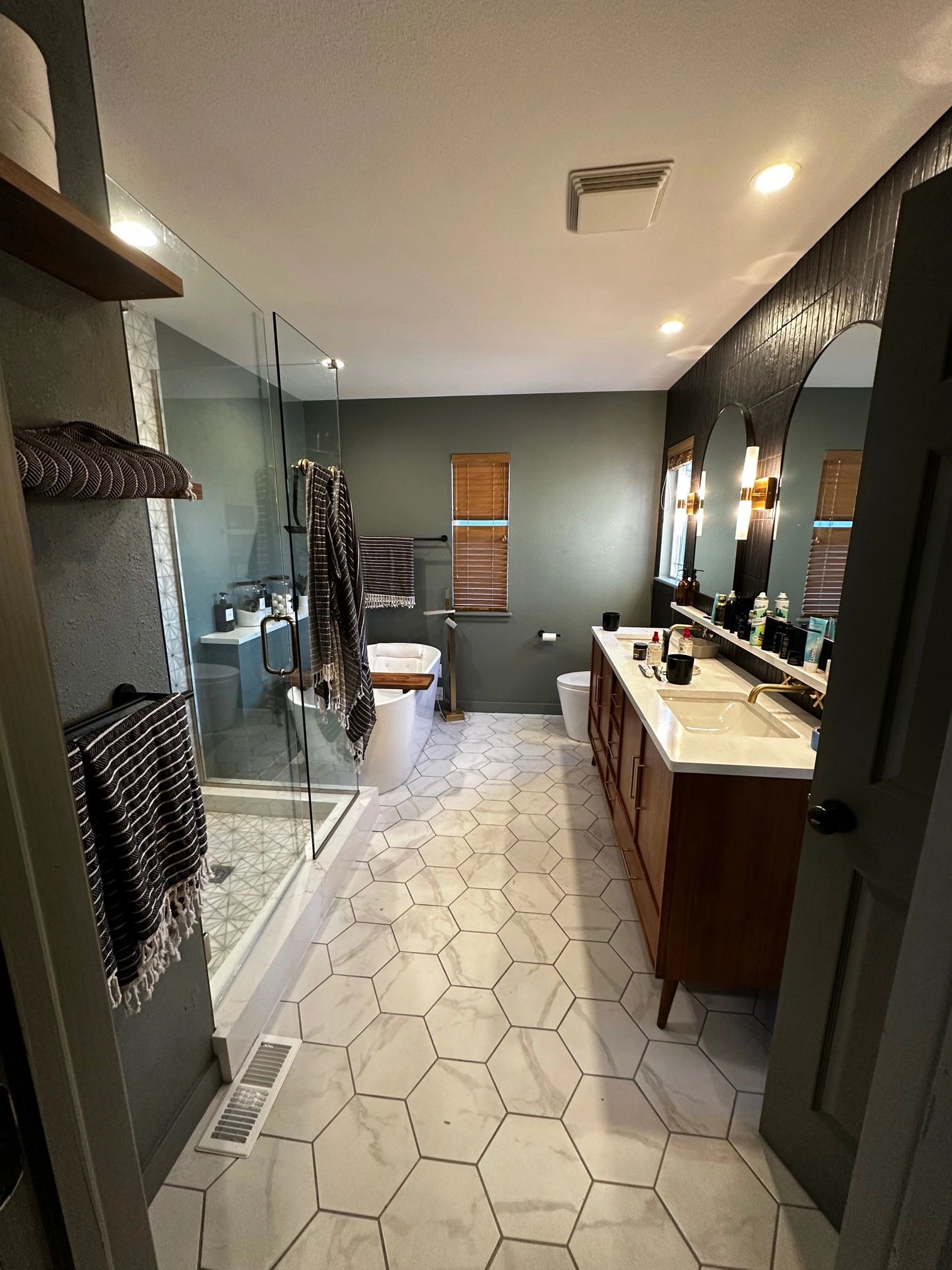 Completed bathroom renovation with glass shower
